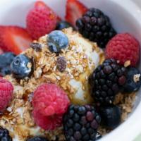 Granola · Greek yogurt, fresh berries drizzled with steen's cane syrup.