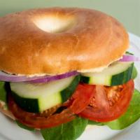 Vegan Bagel Sandwich · Plain bagel, vegan cream cheese, spinach, tomato, red onion, cucumber.