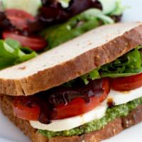 Caprese Sandwich · Semolina toast, fresh mozzarella cheese, tomato, balsamic greens & pesto