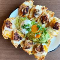 Chicken Fajita Nachos · Texas style nachos – 8 individual tostadas topped with refried beans laden with pork, a blen...