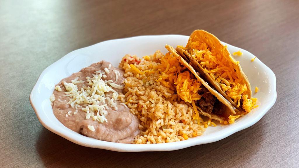 Kid'S Beef Taco (Crispy) · Two crispy shells filled with beef picadillo and shredded cheese. Served with mexican rice, and 2x beans. *gluten-free.