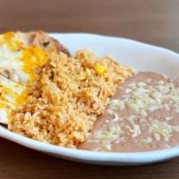 Kid'S Bean And Cheese Nachos · Four bean and cheese nachos. Served with mexican rice, and refried beans. *gluten-free.