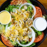 Grilled Chicken Salad · Sliced grilled chicken breast with crispy romaine lettuce, tomatoes, onions, cucumbers, crou...