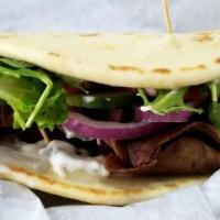 Gyro · Choice of lamb and beef, veggie Pattie, grilled chicken, or brisket with tzatziki sauce, on ...