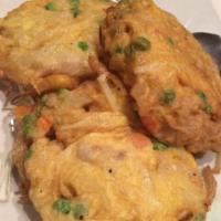 Egg Fu-Yung · A Shanghai recipe. Pan-fried egg patties filled with, peas, carrots, onions, cabbage, and yo...