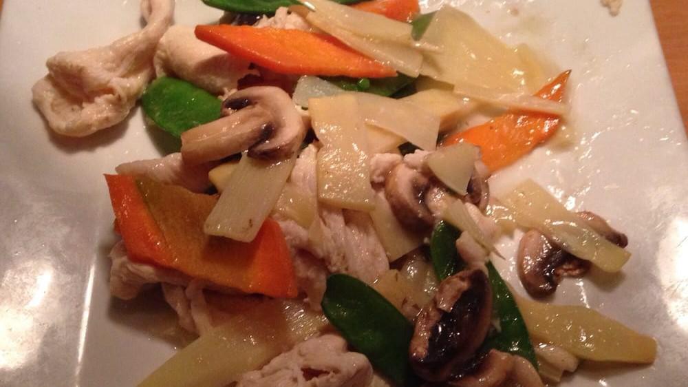 Moo Goo Gai Pan · Sliced white chicken meat stir-fried with mushrooms, carrots, and snow peas in a white sauce.