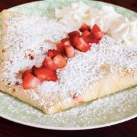 French Strawberry Cheesecake · Sweetened cream cheese, fresh strawberries and powdered sugar.