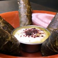 Grape Leaves · Hand-rolled vine leaves stuffed with a savory mix of brown rice, diced tomatoes, diced onion...