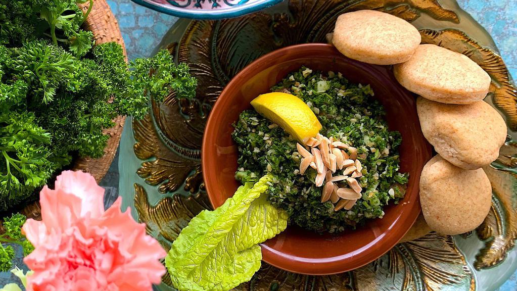 Tabbouleh Salad · Finely chopped parsley with cracked wheat, diced tomatoes, diced cucumbers, and fresh mint in lemon-olive oil dressing. Topped with raw almonds.