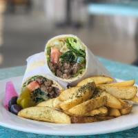 Shawermah Wrap · Thin strips of meat marinated in organic olive oil and various traditional fresh spices, gri...