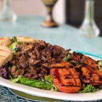 Shawermah Platter (Lunch) · Marinated, thinly sliced meat, served over mixed greens with grilled Roma tomatoes, tahini s...