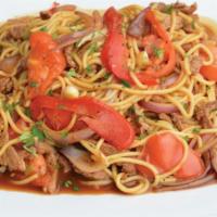 Tallarin Saltado De Pollo · Spaghetti mixed with fresh chicken sautéed in oil, red and green onions, tomatoes, red and y...