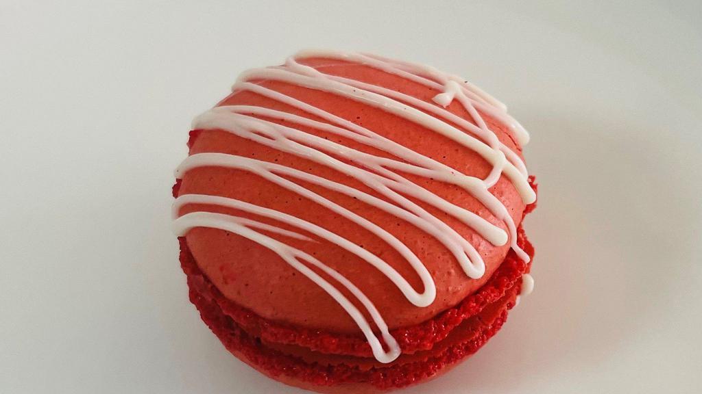 Red Velvet Macaron · Red Velvet Macaron topped with white chocolate drizzle