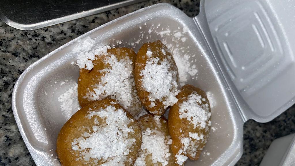 Deep Fried Oreos · 5 pc Golden brown deep fried Oreos topped with powdered sugar!