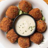 Pepperjack Boudin Bombers · Creole sausage made with pork, pepper jack cheese & rice, rolled & fried crispy, Ernst sauce