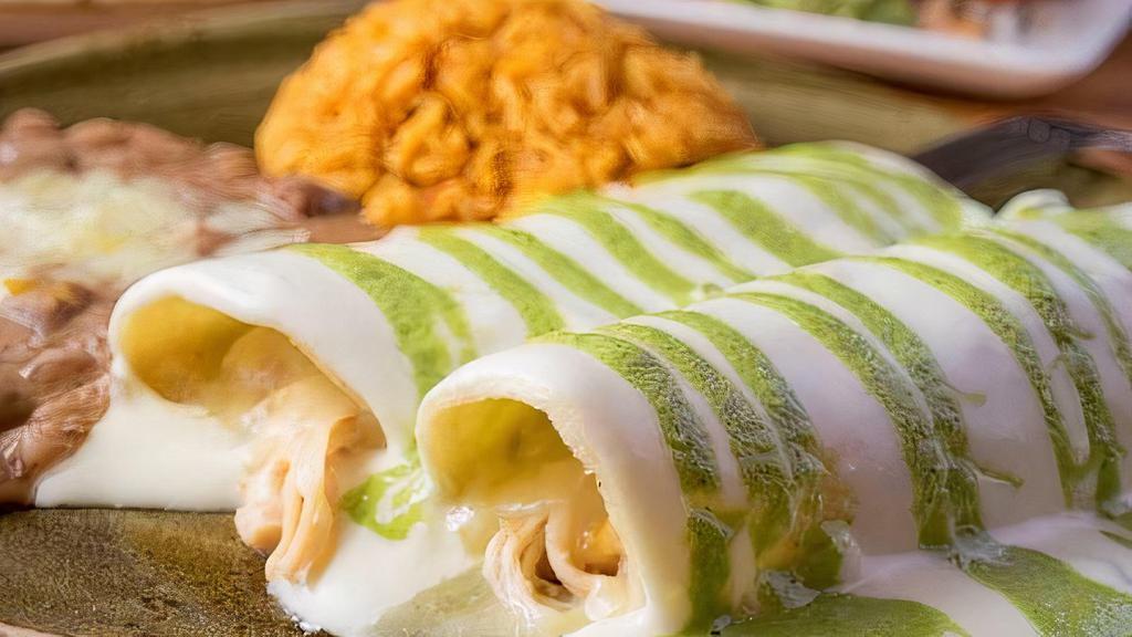 Enchilada Cheese Three · Cheddar cheese and onion enchiladas with chili con carne and more cheddar
