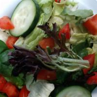 Side Salad · Crisp salad mix with tomato and cucumber.