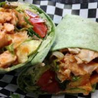 Buffalo Chicken Wrap · Grilled chicken tossed in buffalo sauce with lettuce and tomato, served in a wrap with your ...