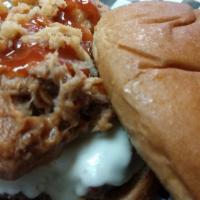 Our New Papa Nick Burger · Half pound burger covered in provolone cheese, topped with 1/4 pound of tomato bbq and duste...