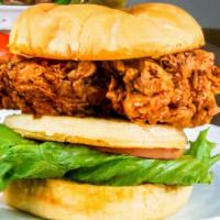 The Deep South · Toasted Kaiser roll. Classic buttermilk fried chicken, waffles, apple smoked bacon, leaf let...