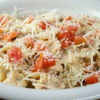 Olt Pasta · Sautéed chicken with bacon and red onion in a light cream sauce tossed with bowtie pasta and...