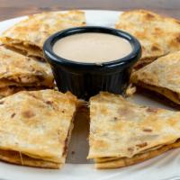 Stacked Chipotle Chicken Quesadilla · Grilled chipotle chicken with ghost pepper and cheddar cheese, bacon, stacked, and served wi...