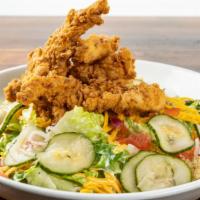 Crispy Chicken Salad · Cheddar cheese, tomato, cucumber, red onion, croutons tossed in ranch with fried chicken ten...