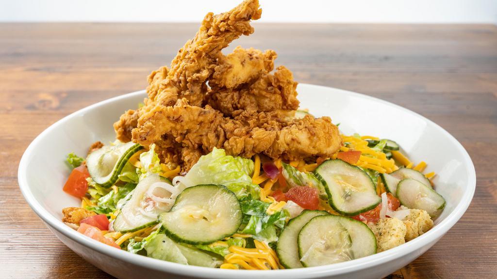 Crispy Chicken Salad · Cheddar cheese, tomato, cucumber, red onion, croutons tossed in ranch with fried chicken tenders.