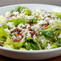 Tavern Salad · Bacon, red onion, and bleu cheese crumbs, with house vinaigrette.