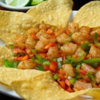 Grilled Ceviche · Grilled shrimp cut into small pieces. Cooked with red and green peppers and grilled onion.