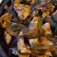 Fajitas · Tender strips of steak, chicken or mixed. Served with sautéed onions, bell peppers, and toma...