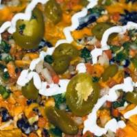 Loaded Nachos · Chips topped with your choice of fajita meat, chorizo, black beans, mozzarella cheese, chees...