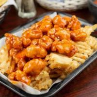 Wing Nachos · Waffle fries topped with boneless wings. Served with your choice of buffalo, teriyaki, mango...
