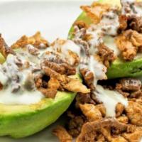 Avocado Bomb · A whole avocado split in half, topped with your choice of fajita meat and cheese sauce. Serv...