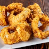 Steakhouse Onion Rings	 · Steak cut sweet Spanish onions, beer battered. Served hot & crispy with a sweet & tangy BBQ ...