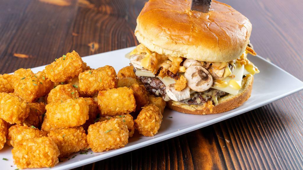 Mushroom Swiss Burger	 · Our signature 8 ounce black Angus beef burger topped with sautéed mushrooms, crispy onion straws and melted Swiss cheese.