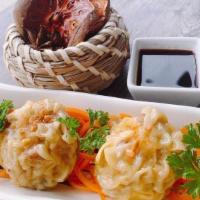 Dumpling (4 Pieces) · Steamed or fried dumplings filled with pork and shrimp.