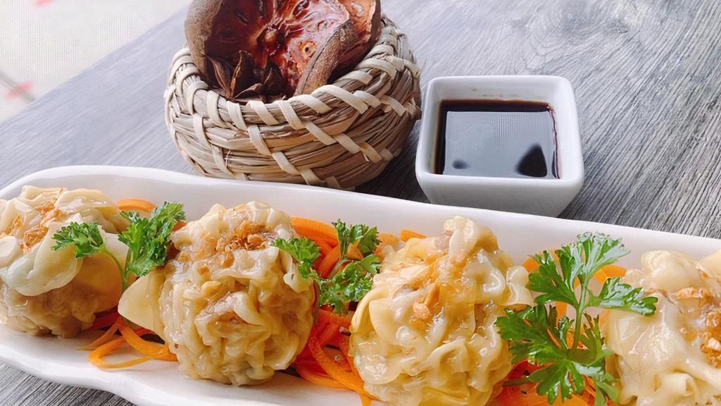 Dumpling (4 Pieces) · Steamed or fried dumplings filled with pork and shrimp.