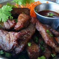 Thai Jerk Beef · Flavorful jerk beef served with homemade spicy chili sauce.