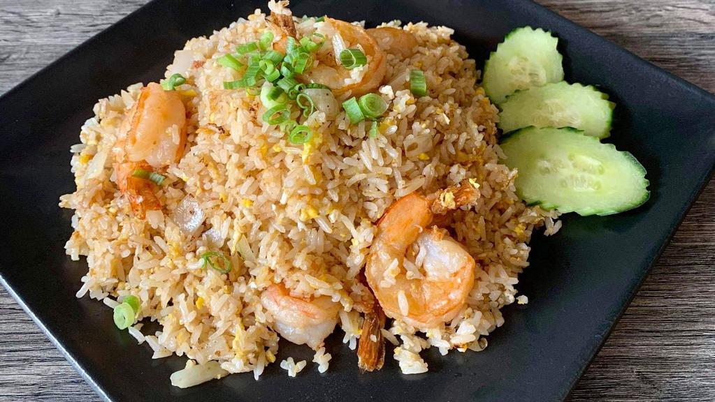 Thai Fried Rice · Stir fried rice with egg, diced onions & scallions.