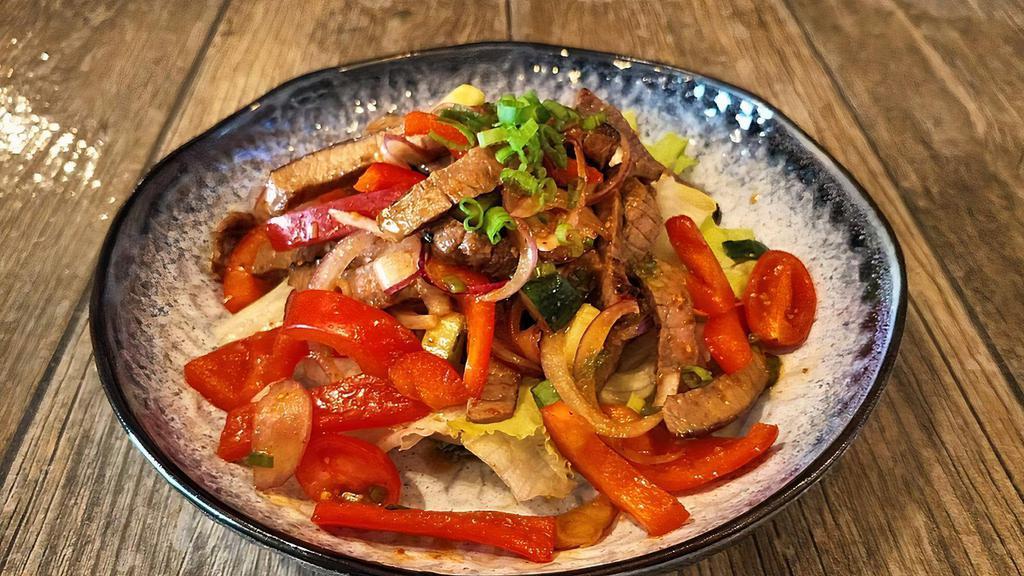 Beef Salad · (Spicy) Sliced grilled tender beef seasoned with spicy dressing, red bell peppers, tomatoes, onions and cucumber.