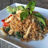 Basil Fried Rice · Fried rice with hot chili garlic sauce, onions, basil & red bell peppers.