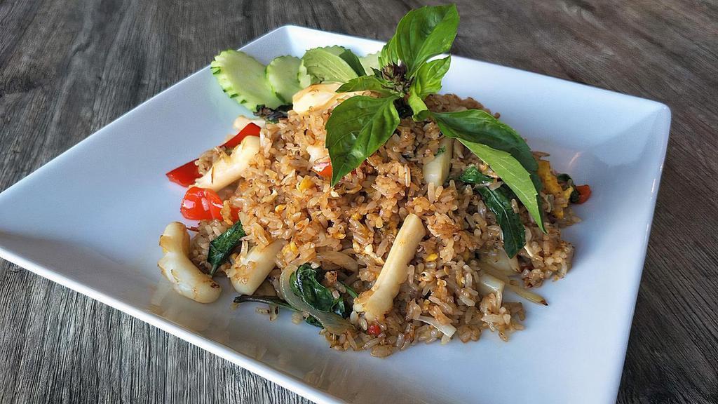Basil Fried Rice · Fried rice with hot chili garlic sauce, onions, basil & red bell peppers.