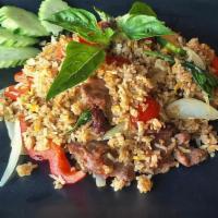 Bangkok Curry Fried Rice · Fried rice with curry paste, basil, Thai spices, zucchini, and onions.