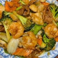 Happy Family · Chicken, beef, shrimp & scallop sauteed w. mixed vegetables in brown sauce.