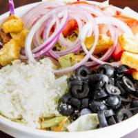 Greek Salad · Lettuce blend, tomatoes, purple onions, black olives, feta cheese, and croutons.