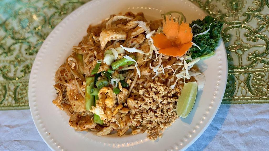 Pad Thai · Thai rice noodles,egg,bean sprout and green onion stir fried in a sweet and sour tamarind sauce serves with crushed roasted peanuts and fresh lime with chick,
pork, veg or tofu  beef+$1.00 shrimp+$2.00
seafood+$3.00 combo+$3.00