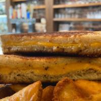 Grilled Cheese Sandwich · Melted American cheese with a side of fries