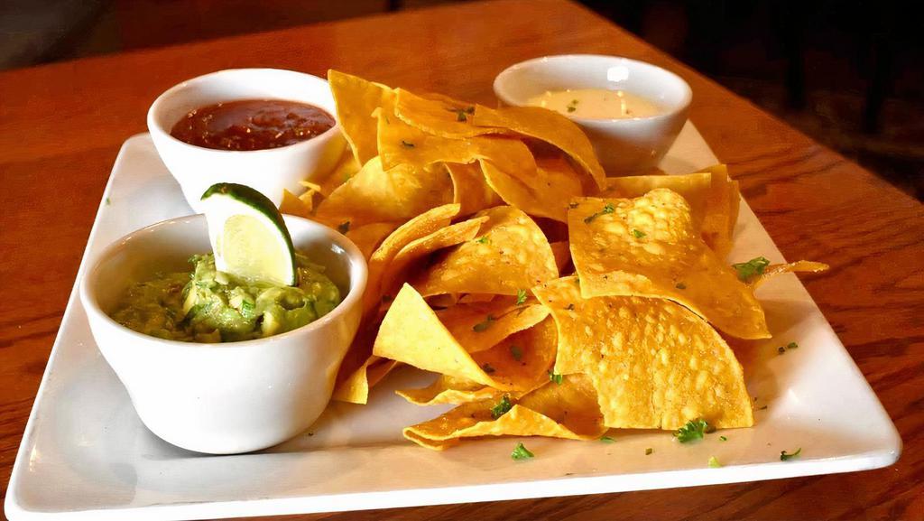 Chips & Dip · Homemade fire roasted salsa, fresh guacamole and melted queso dip, served with warm crispy tortilla chips.