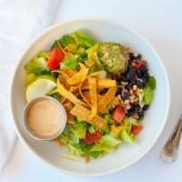 Southwest Caesar · Chopped romaine tossed in chipotle Caesar, topped with fresh black bean and corn salsa, shre...